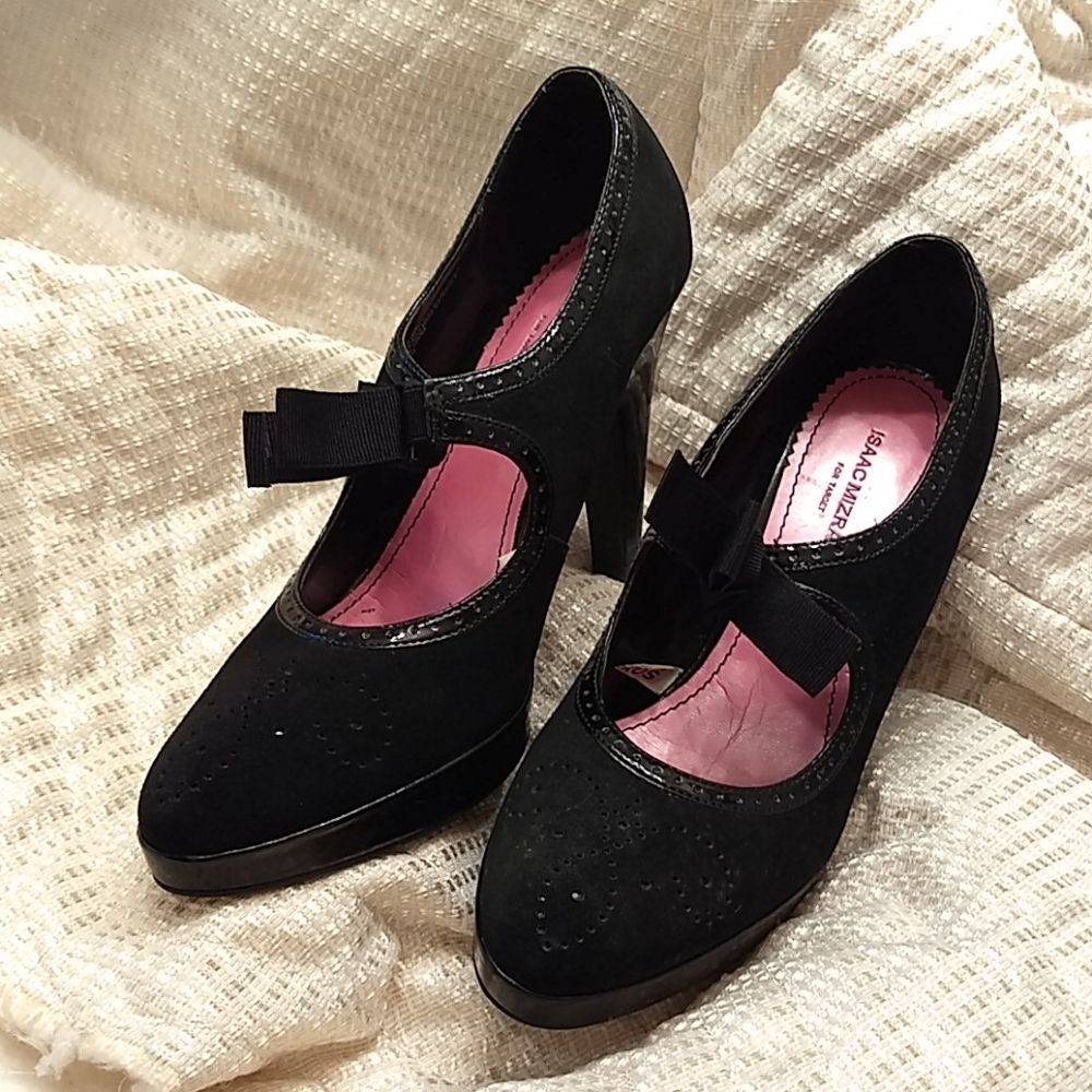 A Pair of Black Suede and Patent Heels
